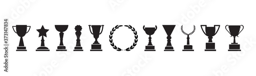 Trophy cup, award and laurel wreath, champion icons, black silhouettes isolated on white background. Vector illustration