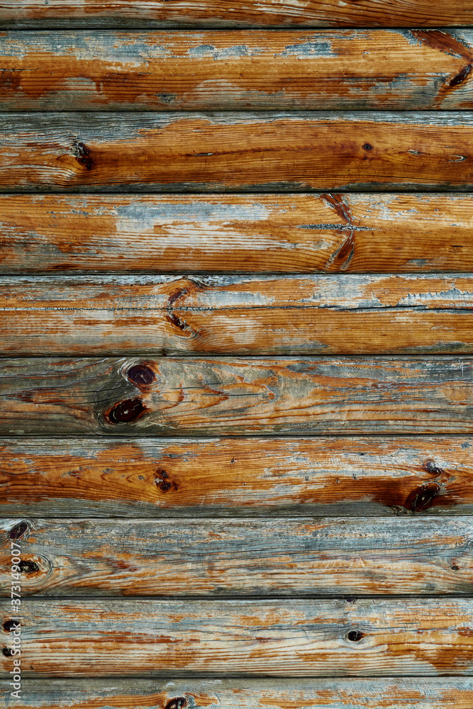 old weathered wooden planks as a brown background, peeling paint and cracks old weathered wooden planks as a brown background, peeling paint and cracks
