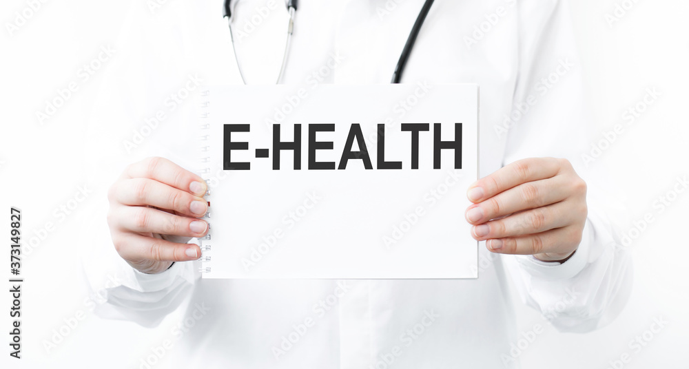 Doctor holding a card with E-Health medical concept Doctor holding a card with E-Health medical concept