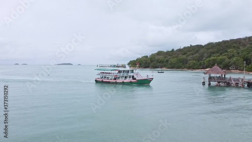 Wallpaper Mural wooden green ferry boat with passengers arriving the port at Samed Island. Torontodigital.ca