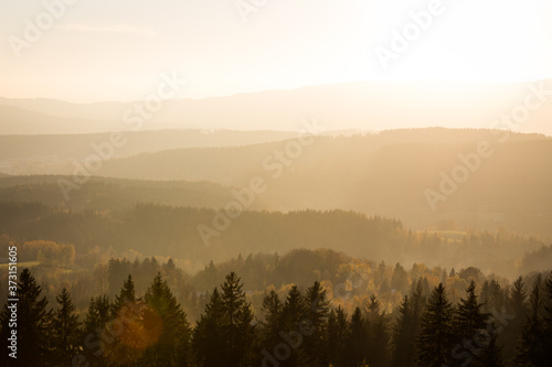 Watching sunset over the forest from Slovanka lookout tower near Janov nad Nisou, Czechia
