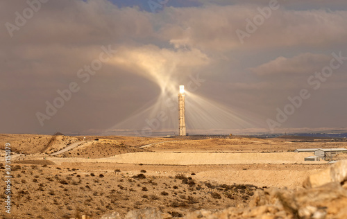 The Megalim solar power station in the Negev desert in Israel. The huge technological structure of alternative energetics. Strong light spreads around