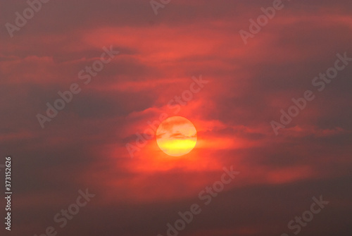 sun  through smoke from wildfire