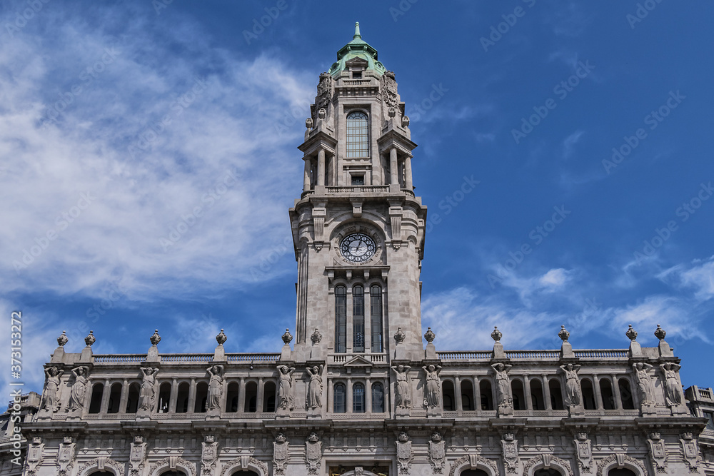 View of 70m high tower with a carillon clock at City Hall building (Camara Municipal do Porto). City Hall - a Neoclassic building at Avenida dos Aliados in Porto, Portugal. View of 70m high tower with a carillon clock at City Hall building (Camara Municipal do Porto). City Hall - a Neoclassic building at Avenida dos Aliados in Porto, Portugal.