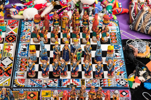 The traditional chess game  handicraft market in Cusco  Peru