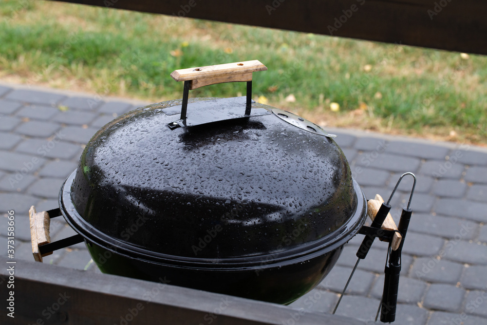 Wet cover of the garden barbecue Wet cover of the garden barbecue