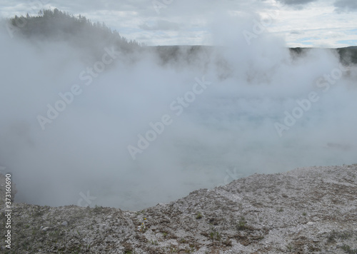 Late Spring in Yellowstone National Park: Dense Steam Rises From Excelsior Geyser Crater in Midway Geyser Basin