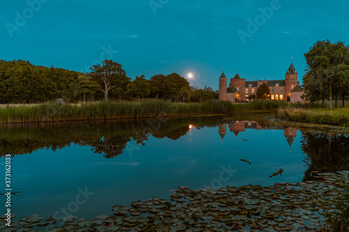 Beautiful shot of Westhove castle at night in Zeeland, The Netherlands photo