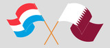 Crossed and waving flags of Luxembourg and Qatar