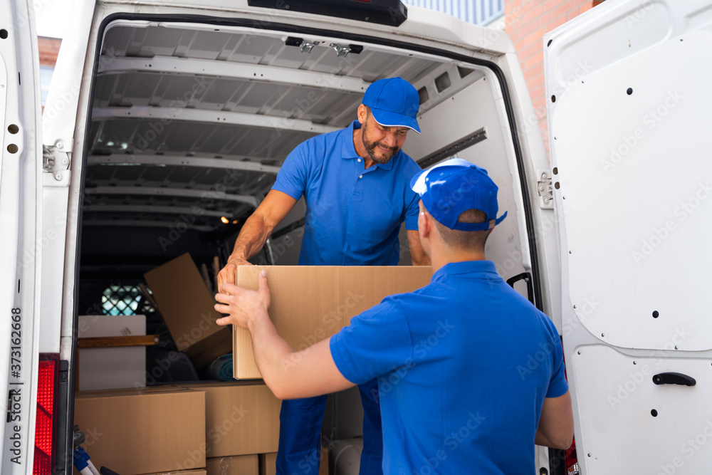 Home Moving Services. Movers Loading Van Home Moving Services. Movers Loading Van