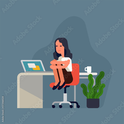 Sad depressed office worker woman at her workplace sitting on chair holding her knees. Flat design vector concept illustration on burnout and lack of motivation at work