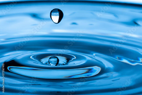 Water drop splash. Blue water 