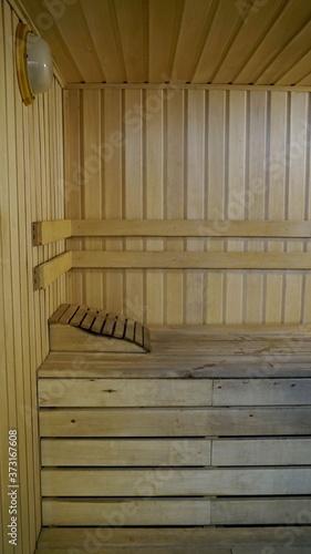 Sauna accessories are in the interior of the steam room. The interior of the sauna. Sauna from linden.