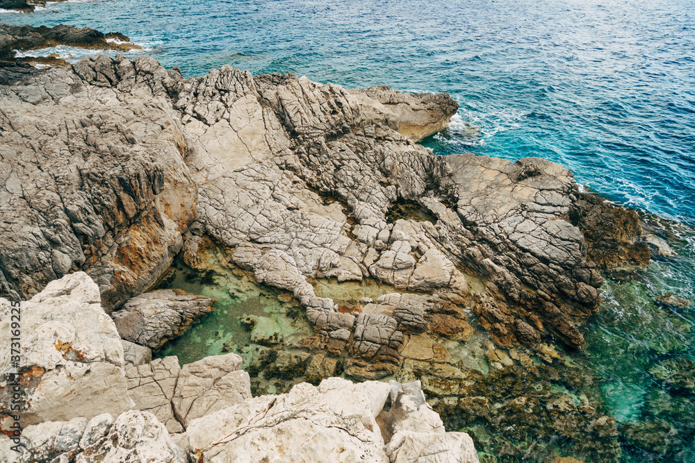 Wild beach on the rocks, Adriatic coast in Montenegro.