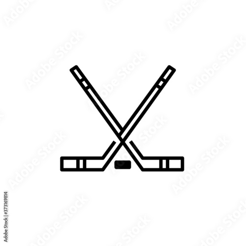 Vector crossed hockey sticks and puck icon set photo