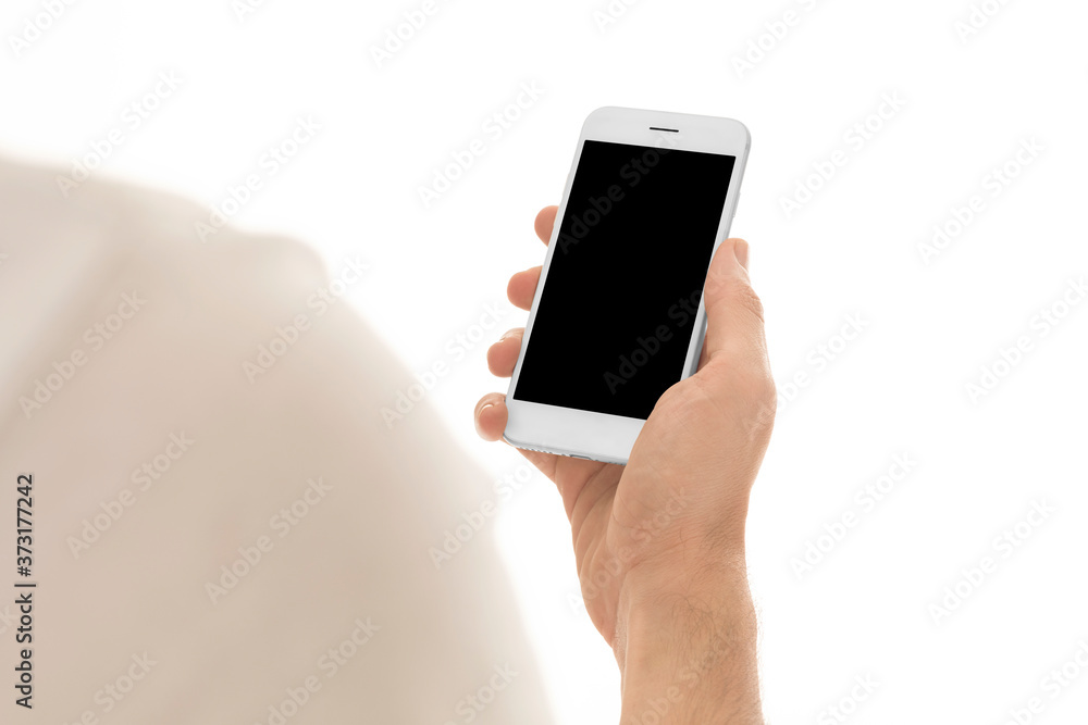 Man holding a smartphone with empty black screen. Mobile phone in a