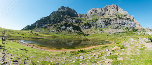 Ibon of Piedrafita in summer, glacial lake in the aragonese Pyrenees photo