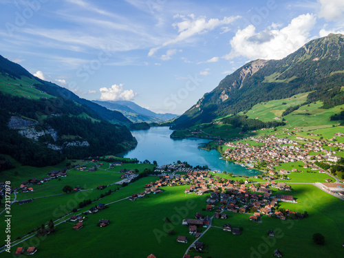 Wonderful Mountain Lake in the Swiss Alps - aerial photography © 4kclips