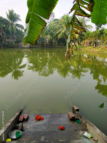 A typical Bengali type pond with steps leading to it at Joygopalpur in West Bengal, India- 9th Feb 2018