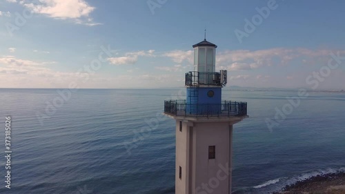 Lighthouse and bad weather in background,aerial view