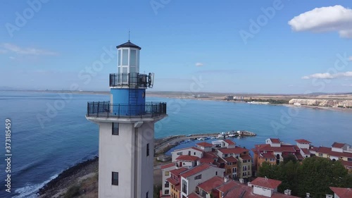 Lighthouse and bad weather in background,aerial view