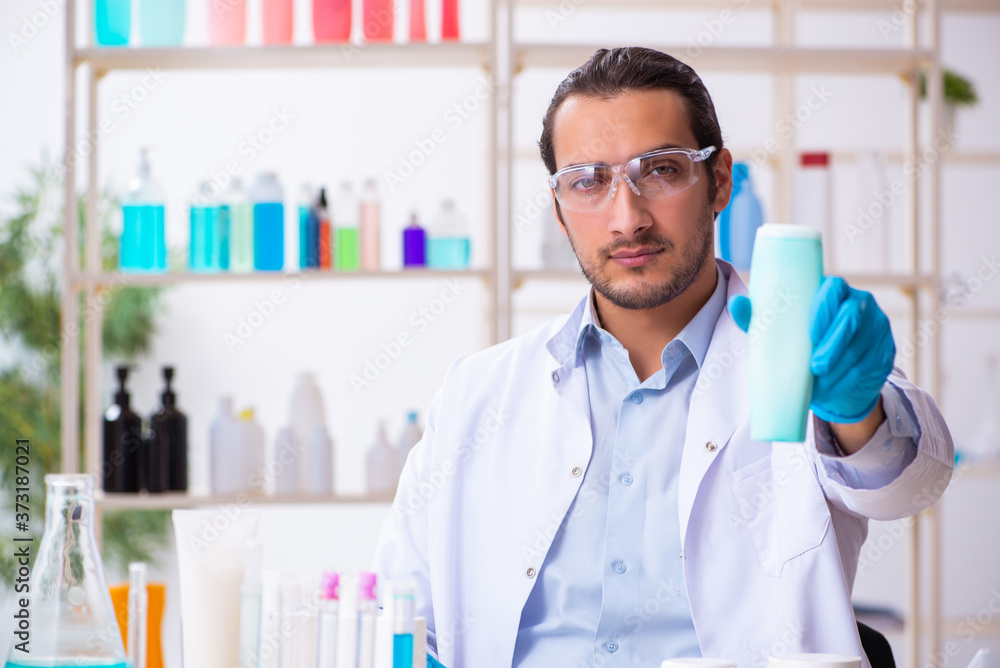 Young male chemist working in the lab Young male chemist working in the lab