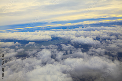Clouds from Airplane Window . Flight over the clouds and river 