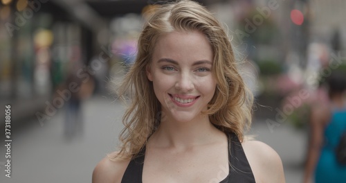Young blond woman in city face portrait smile happy © blvdone