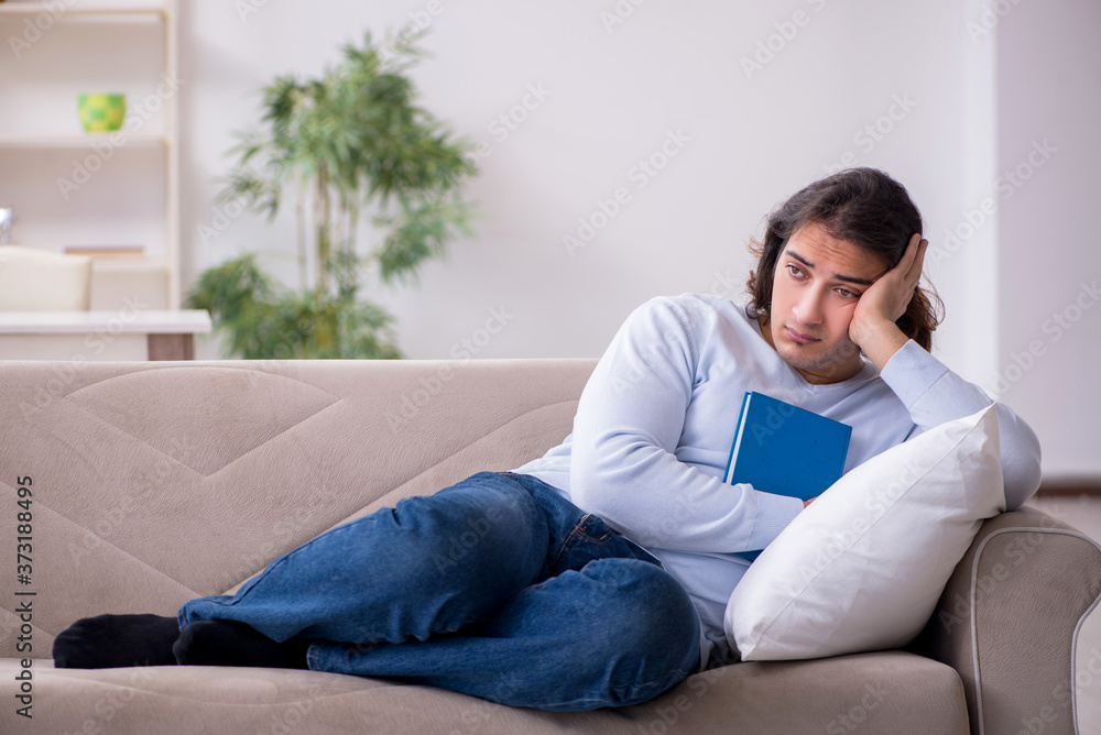 Young male student preparing for exams at home Young male student preparing for exams at home
