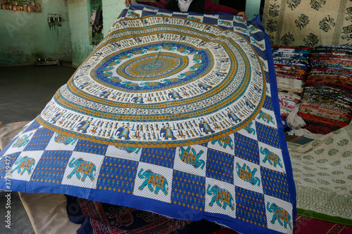 Local weaver displays dhurrie rugs photo