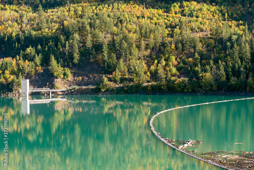 A log boom in the Carpenter Lake Reservoir at the Terzaghi dam in British Columbia, Canada photo
