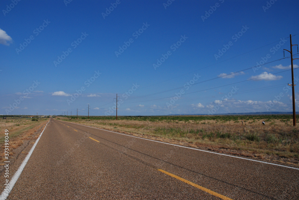 A long straight Route 66 road between Texas and New Mexico, USA. August 4, 2007.