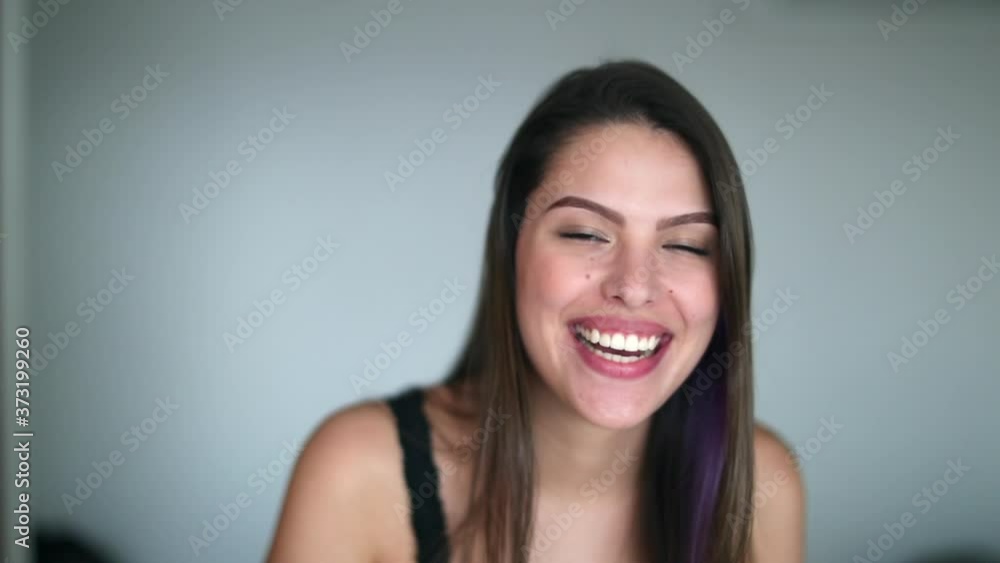 Young woman authentic smile and laugh. Girl laughing out loud, spontaneous real life laugh Young woman authentic smile and laugh. Girl laughing out loud, spontaneous real life laugh