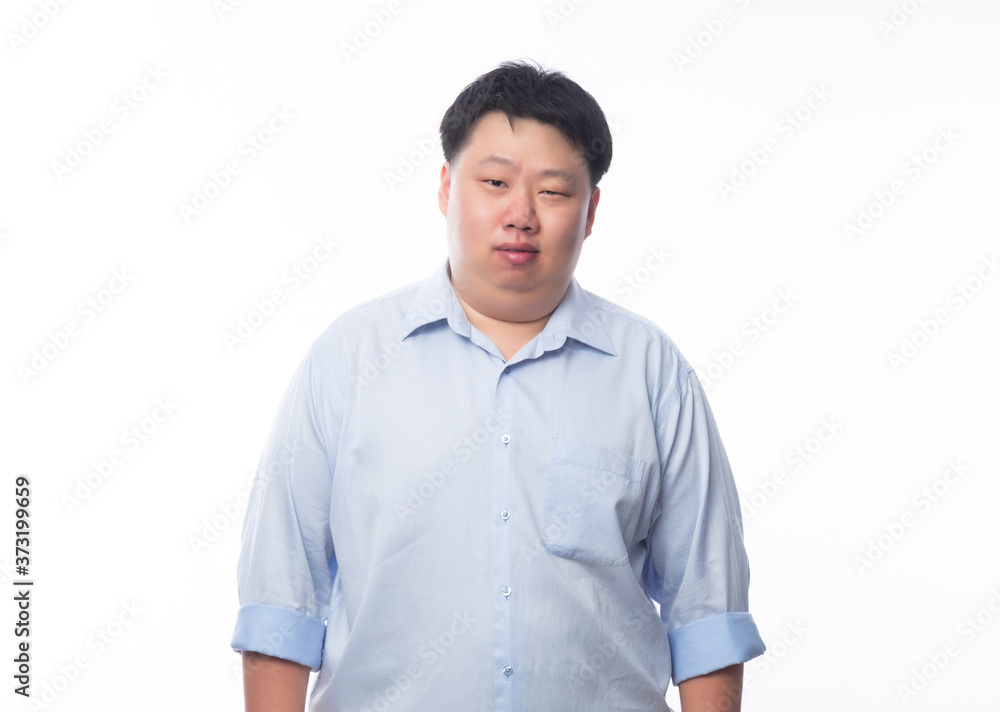 Asian fat man in blue shirt looking to camera isolated on white background. Asian fat man in blue shirt looking to camera isolated on white background.