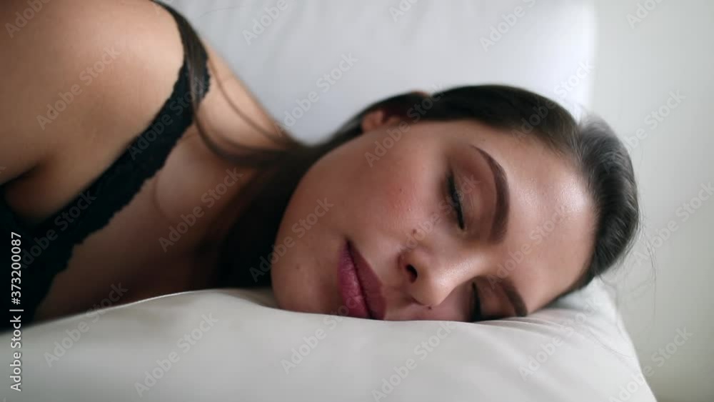 Young woman closing eyes about to nap. Girl closes eye napping Young woman closing eyes about to nap. Girl closes eye napping