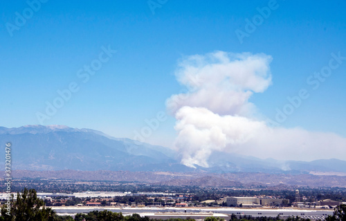 Wildfire smoke emerges from near Banning in the Apple fire of August 2020 in southern California. The cities of Riverside and Moreno Valley are in the foreground