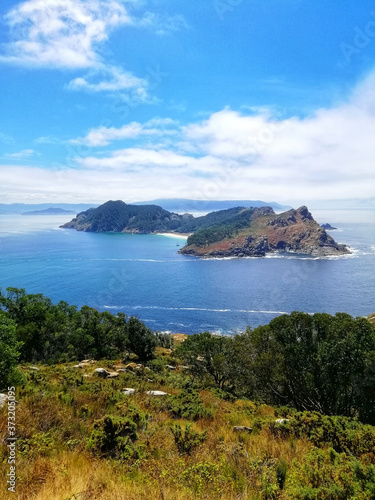 Vertical landscape shot of a beach with plants in Cies Islands, Spain photo