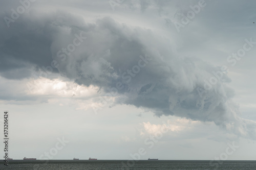 Dramatic clouds over the sea. Creative vintage background. © Виктор Кеталь