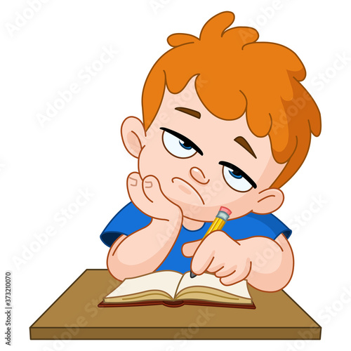 Bored school boy with hand on face sitting at desk writing in his notebook
