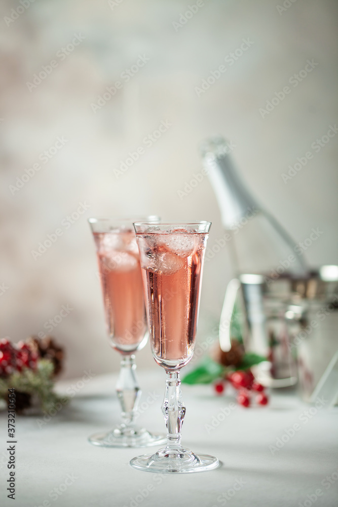 Two glasses of champagne on light background. Festive drink. Valentins or Christmas concept. Two glasses of champagne on light background. Festive drink. Valentins or Christmas concept.