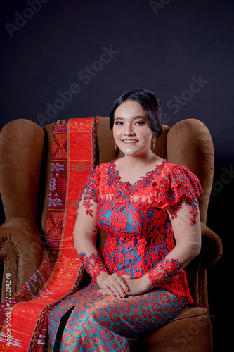 portrait of beautiful indonesian women wearing traditional batak costume photo