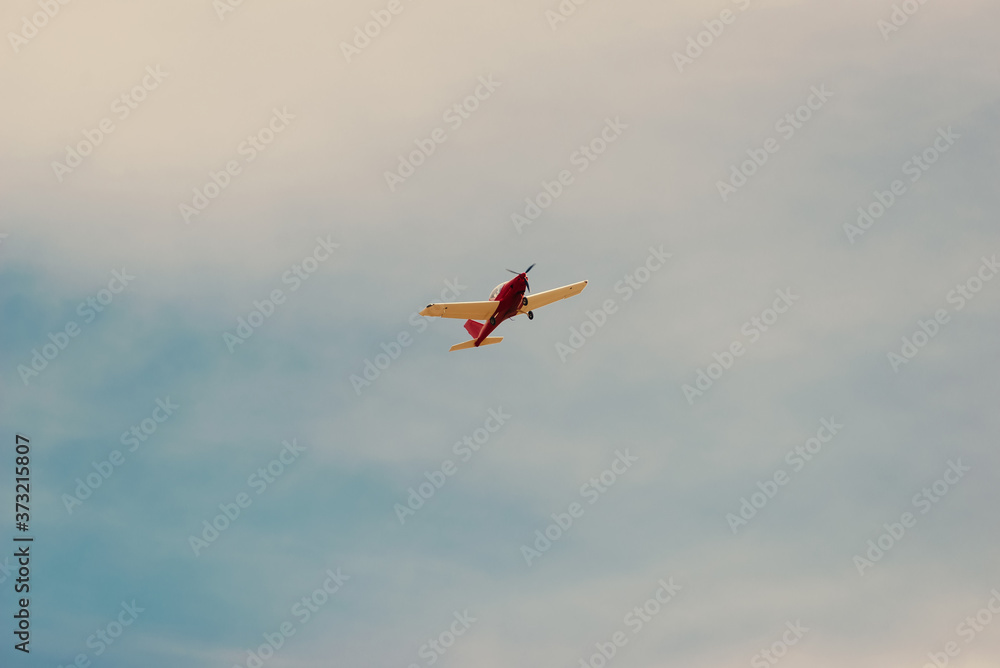 Photo of small airplane flying in a beautiful clean summer day. Photo of small airplane flying in a beautiful clean summer day.