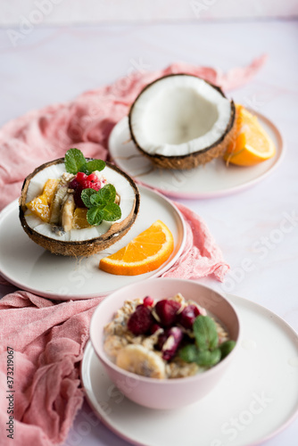 Smoothie bowl with colorful tropical fruits. Summer healthy diet, vegan breakfast.