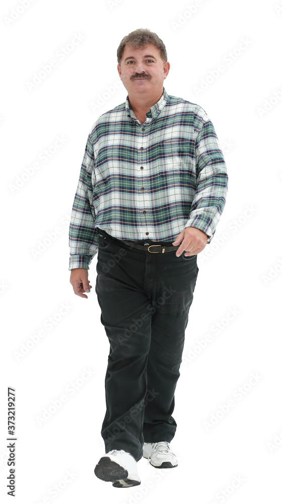 Fototapeta premium an elderly man in a checkered shirt goes forward