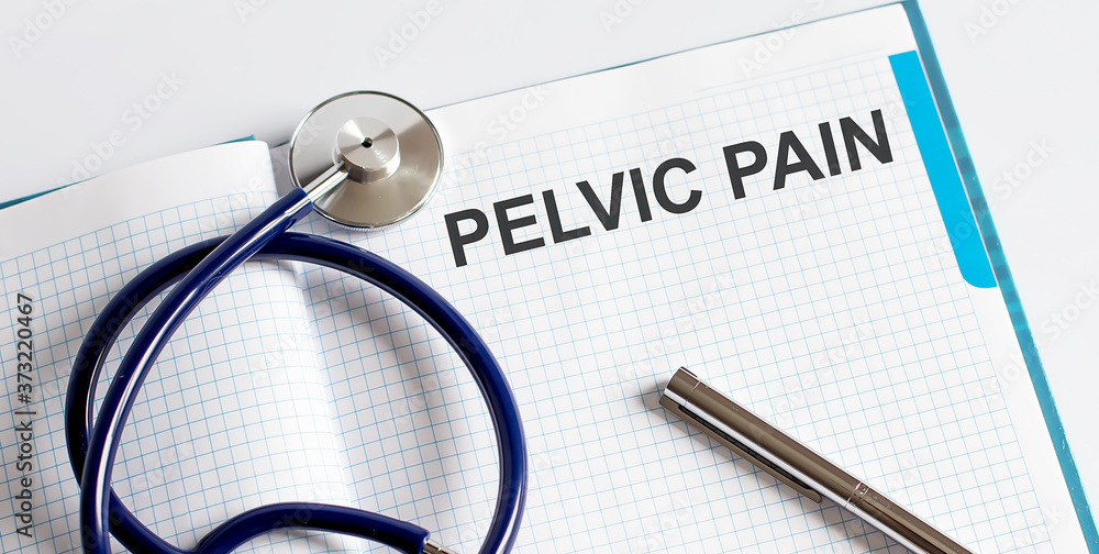 Paper with text PELVIC PAIN on table with stethoscope Paper with text PELVIC PAIN on table with stethoscope