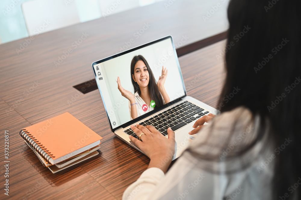 Closeup business woman talking to her colleagues video conference. Closeup business woman talking to her colleagues video conference.