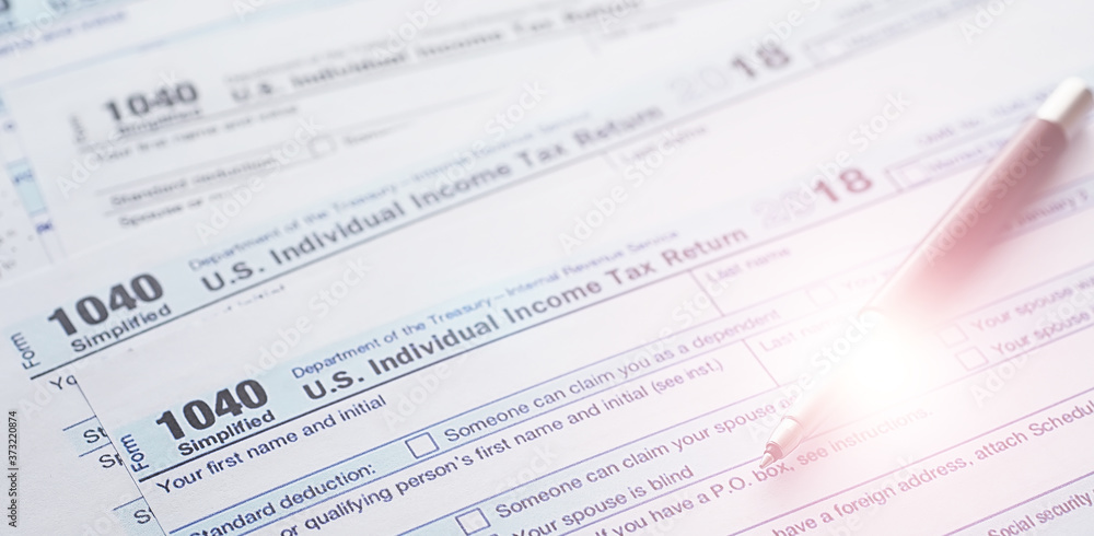 Annual tax reporting. Tax form on the table. Financial statements for signature. Annual tax reporting. Tax form on the table. Financial statements for signature.