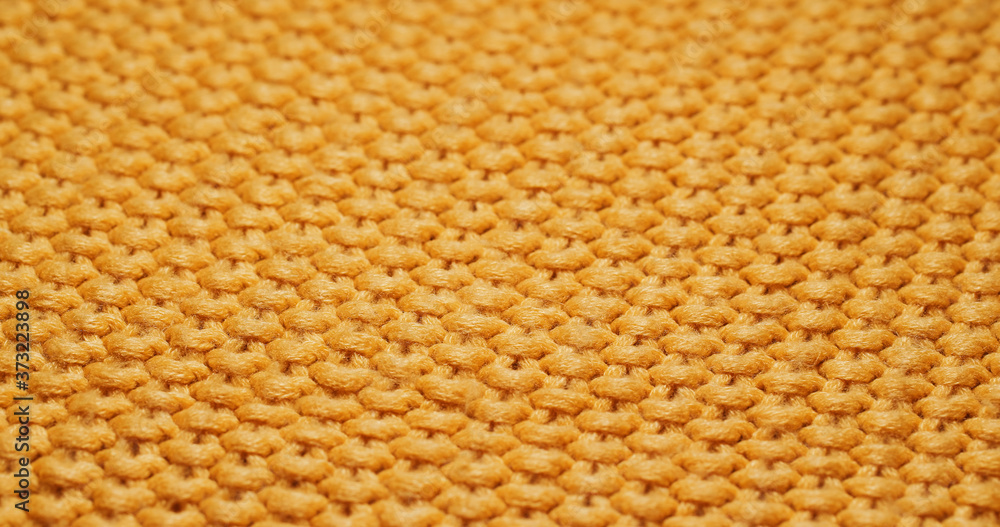 Yellow knitted duvet texture close up Yellow knitted duvet texture close up