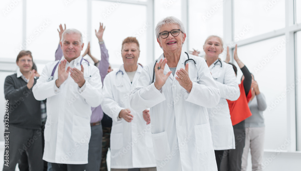 doctors and patients clap their hands. applaud and enjoy success doctors and patients clap their hands. applaud and enjoy success