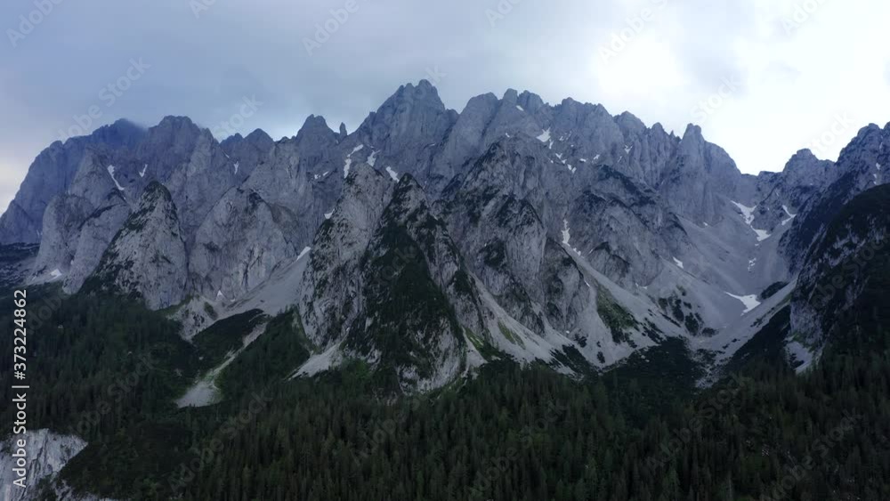 Aerial zoom out fly of Dachstein mountain top summit near Hinterer Gosausee lake Upper Austria Aerial zoom out fly of Dachstein mountain top summit near Hinterer Gosausee lake Upper Austria